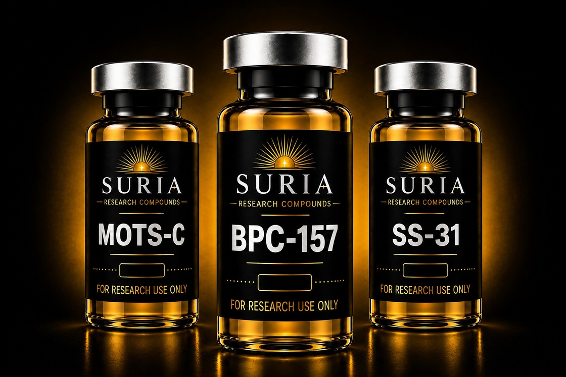 Three Suria Research Compounds vials with silver caps and amber glass, labeled BPC-157, MOTS-C, and SS-31, lit against a dark background with warm gold ambient light